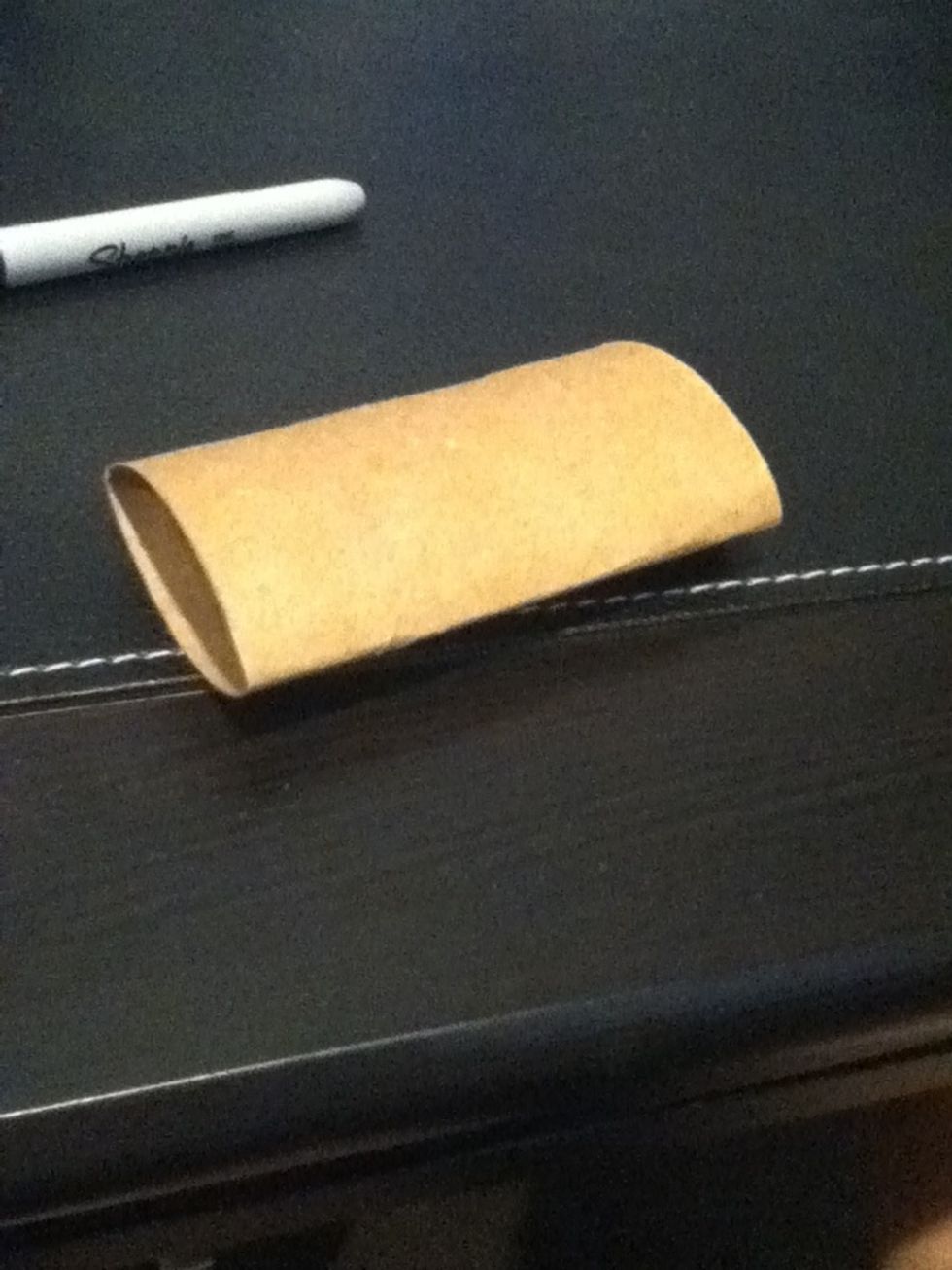 Flatten your toilet paper roll gently.