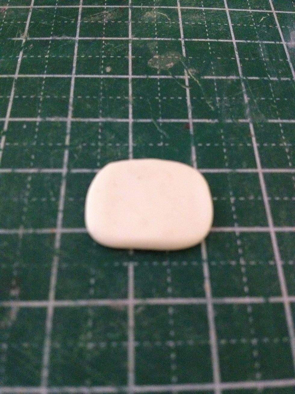 Flatten your white clay into a thick slab. This is going to be the egg 'white'.