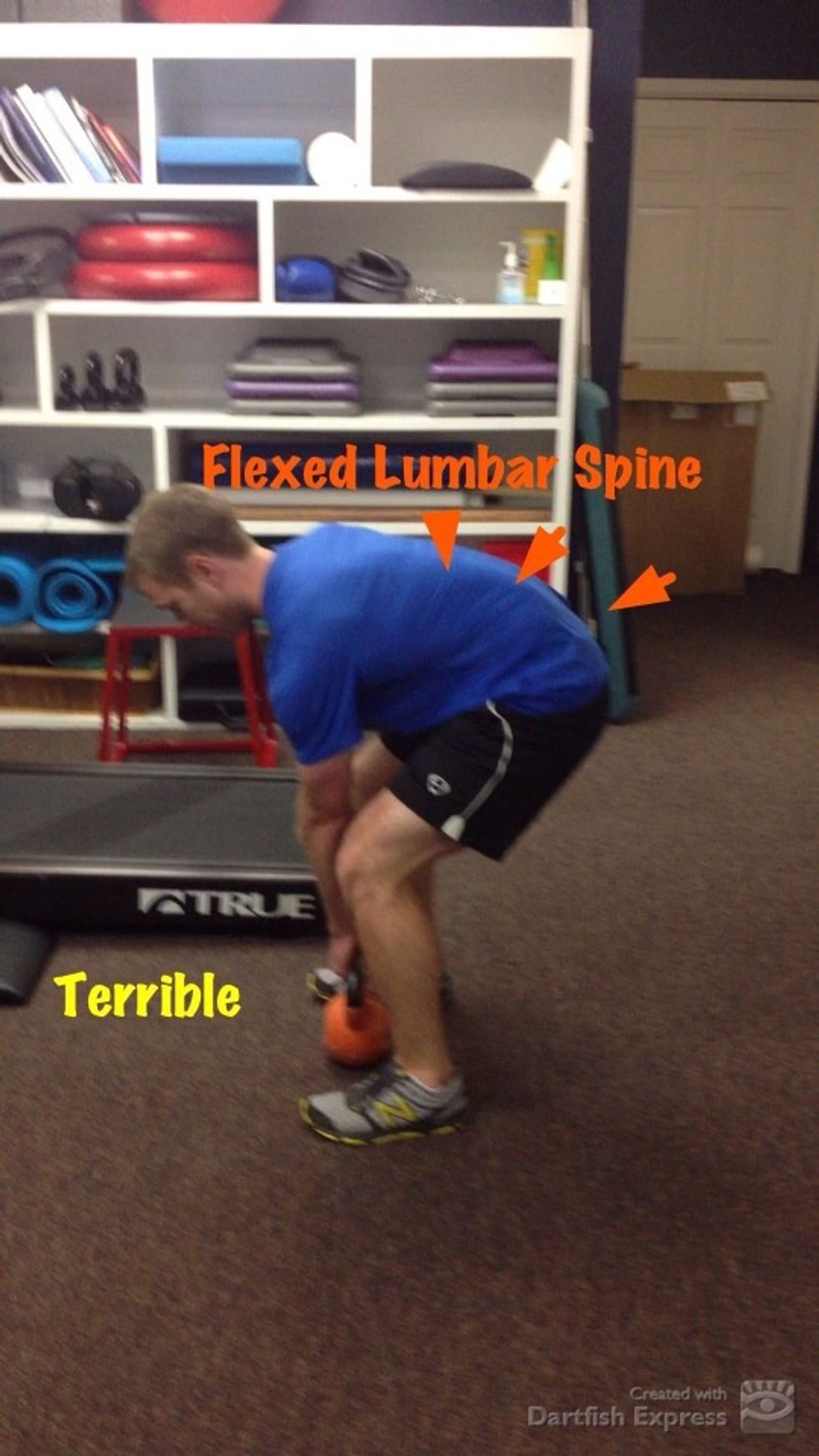 Flexion of lumbar and thoracic spine during pull.