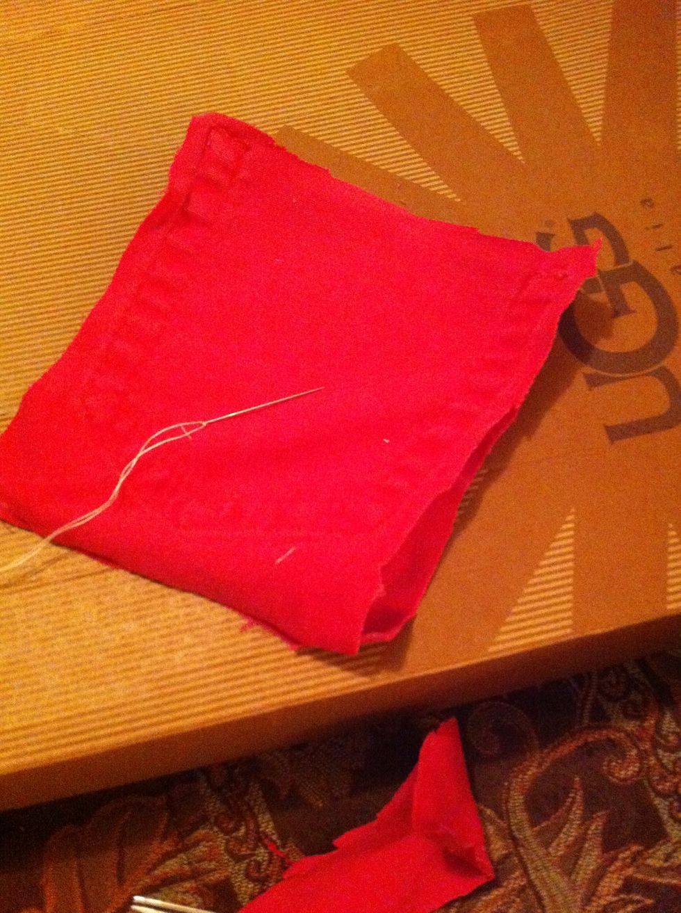 Flip and align your pieces. Also prepare your thread and needle. Excuse my ratchet ugg box.