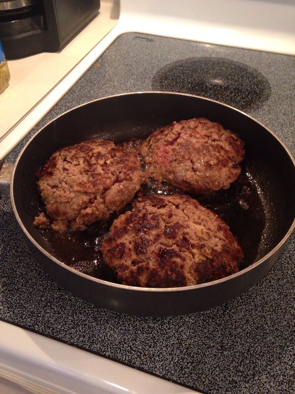 Flip burgers and cook 3-5 minutes on the other side. You do not need to cook the burgers all the way as you will continue to cook them in the oven.
