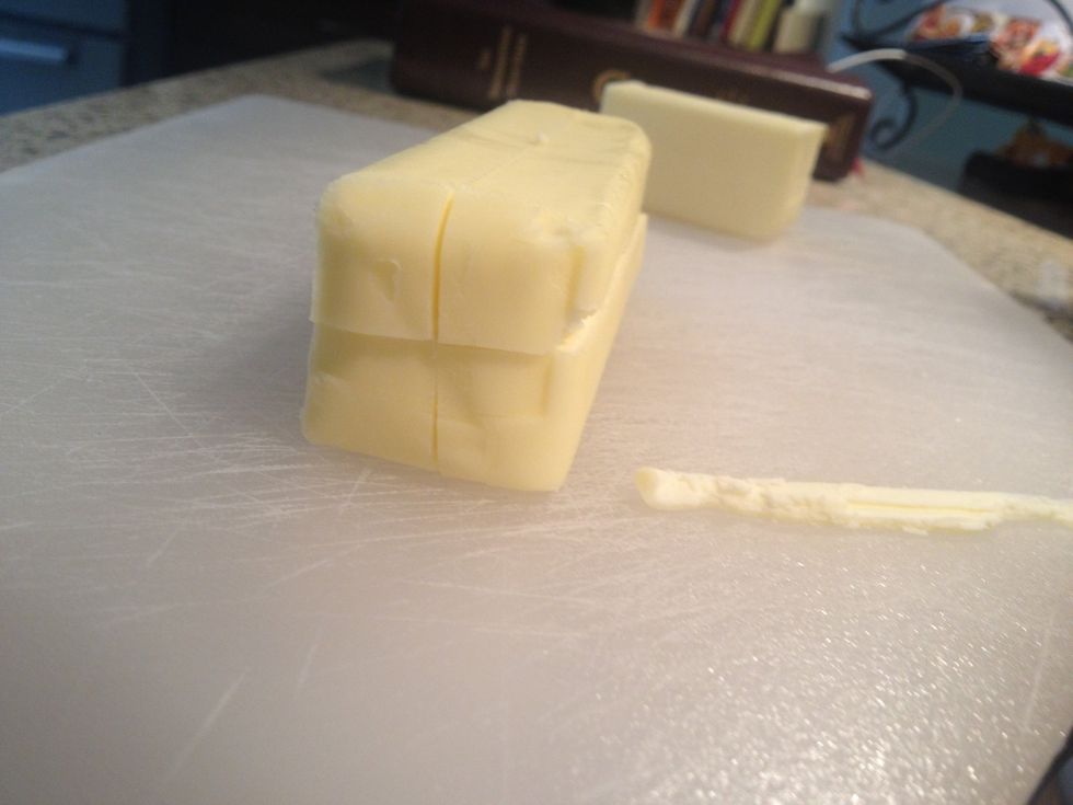 Flip butter on side and slice long ways again to make a cross shape.