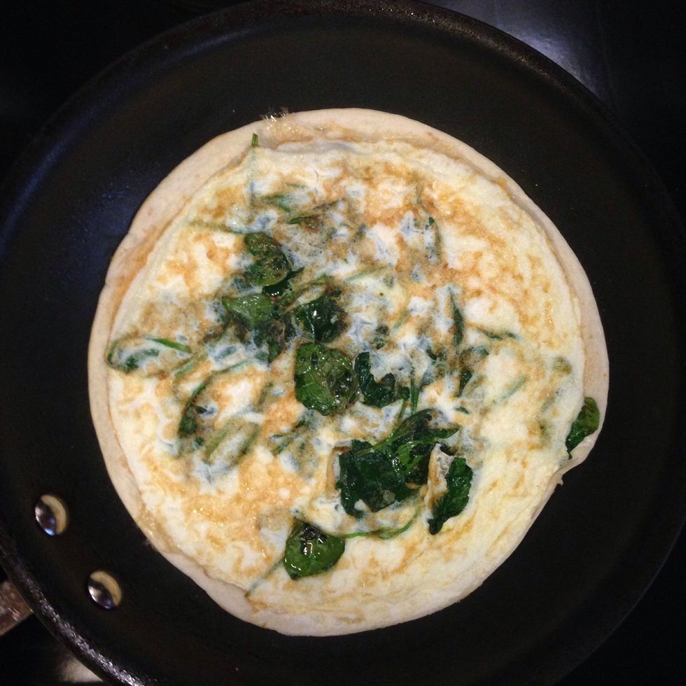 Flip egg and burrito shell to allow the shell to brown.