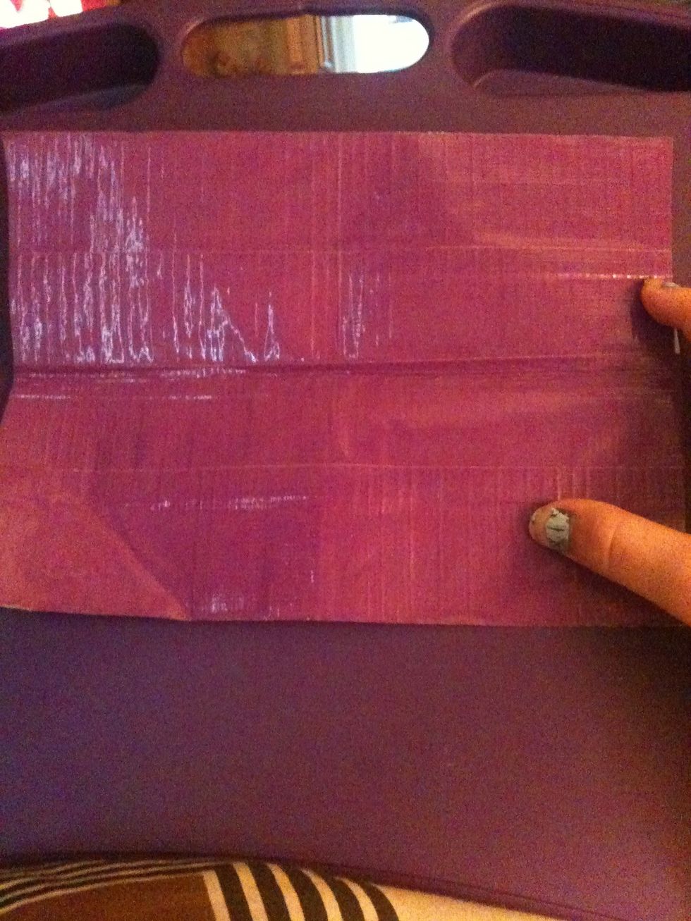 Flip it over and do the same thing you did with the first four strips, so there is no sticky sides showing.