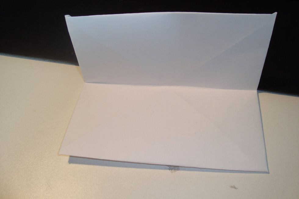 Flip it over and fold it over one way like a sandwich to create a crease.