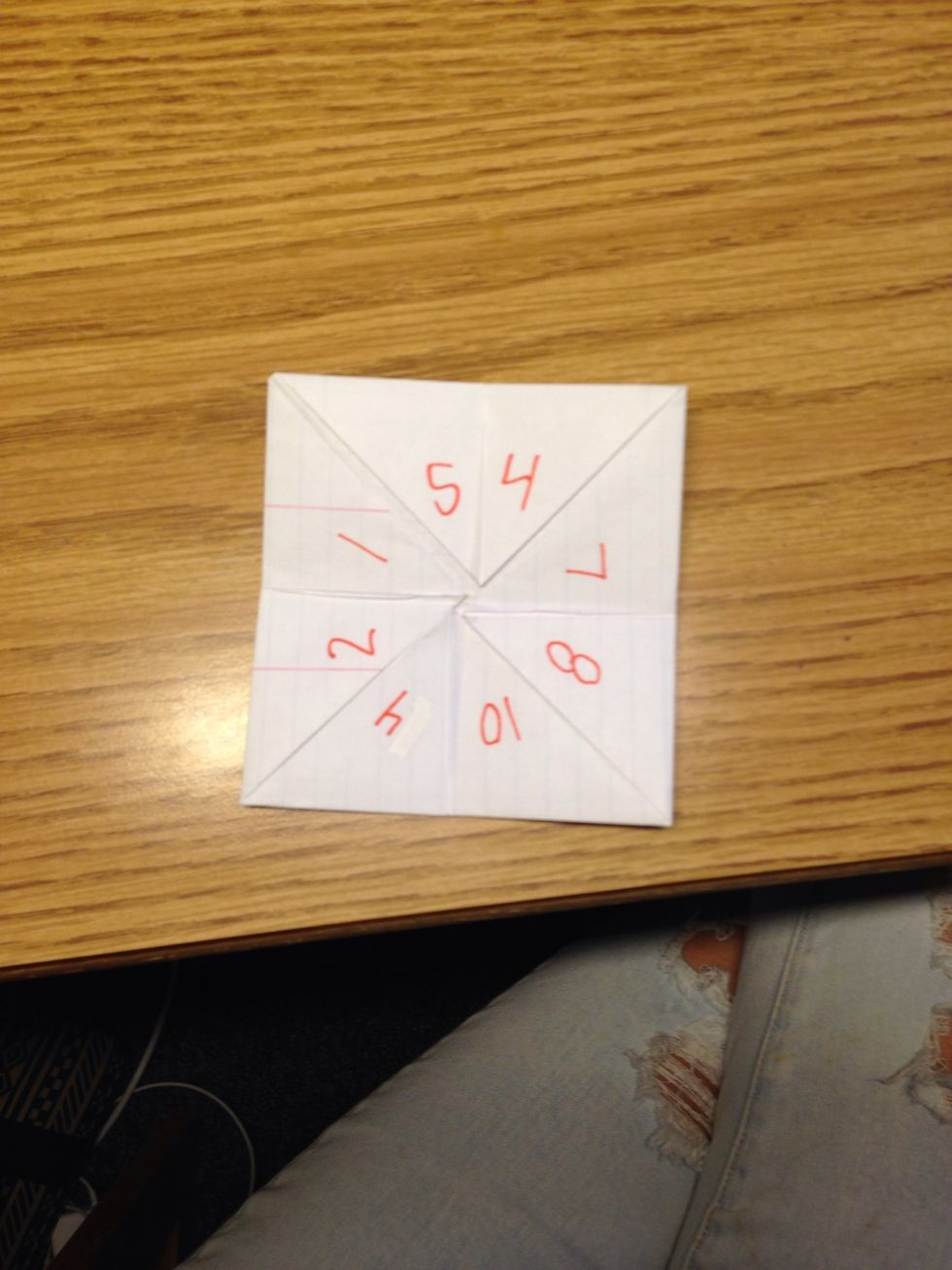 Flip it over and write 8 numbers on the triangles.