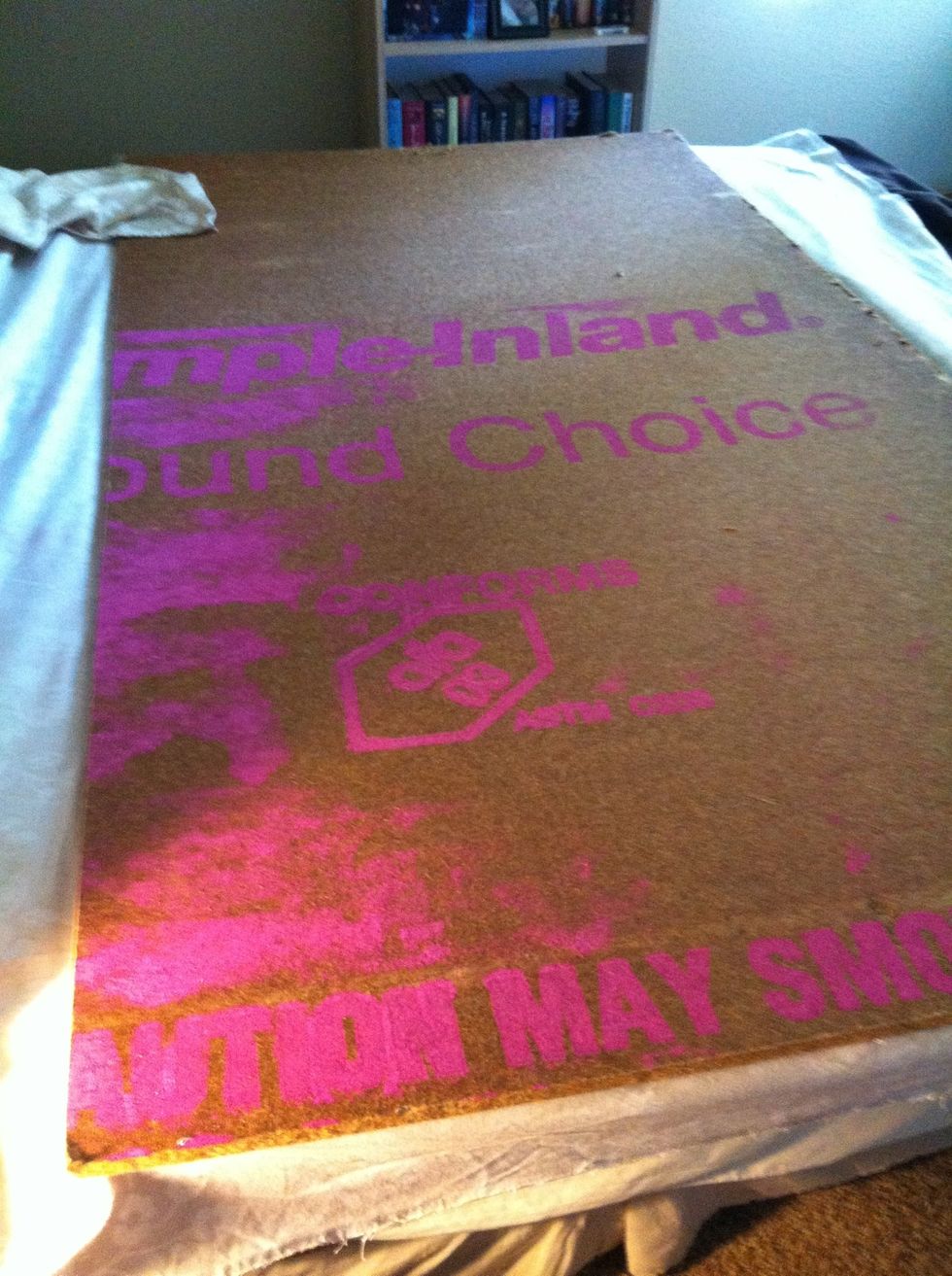 Flip it over. I put the painted lettering side on the back so it would not show through the fabric.