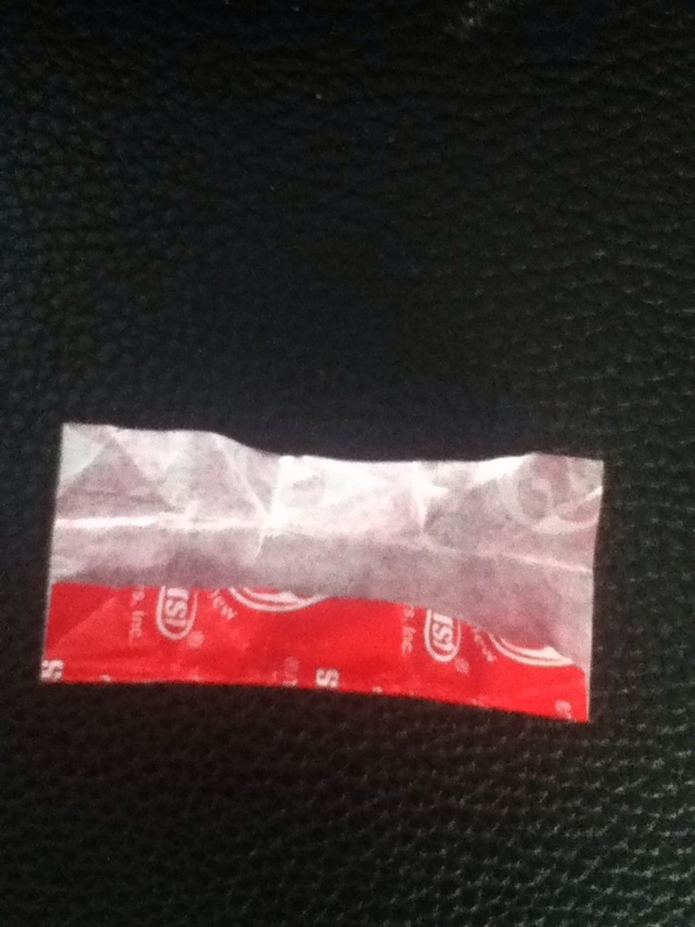 Flip it over to the white side, then fold on side to the halfway point.