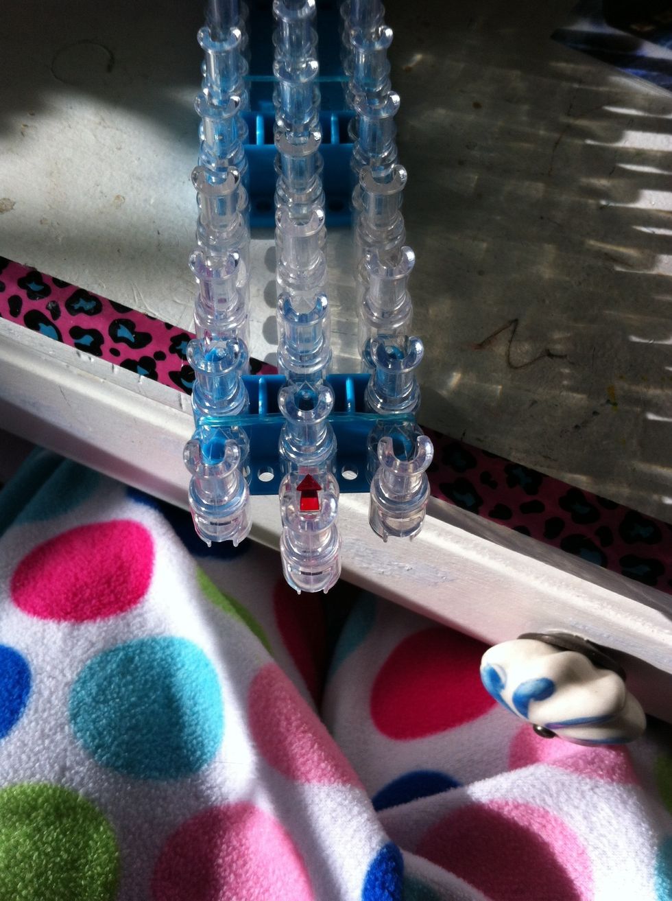 Flip loom over again to start the extension. Have the arrow facing away from you