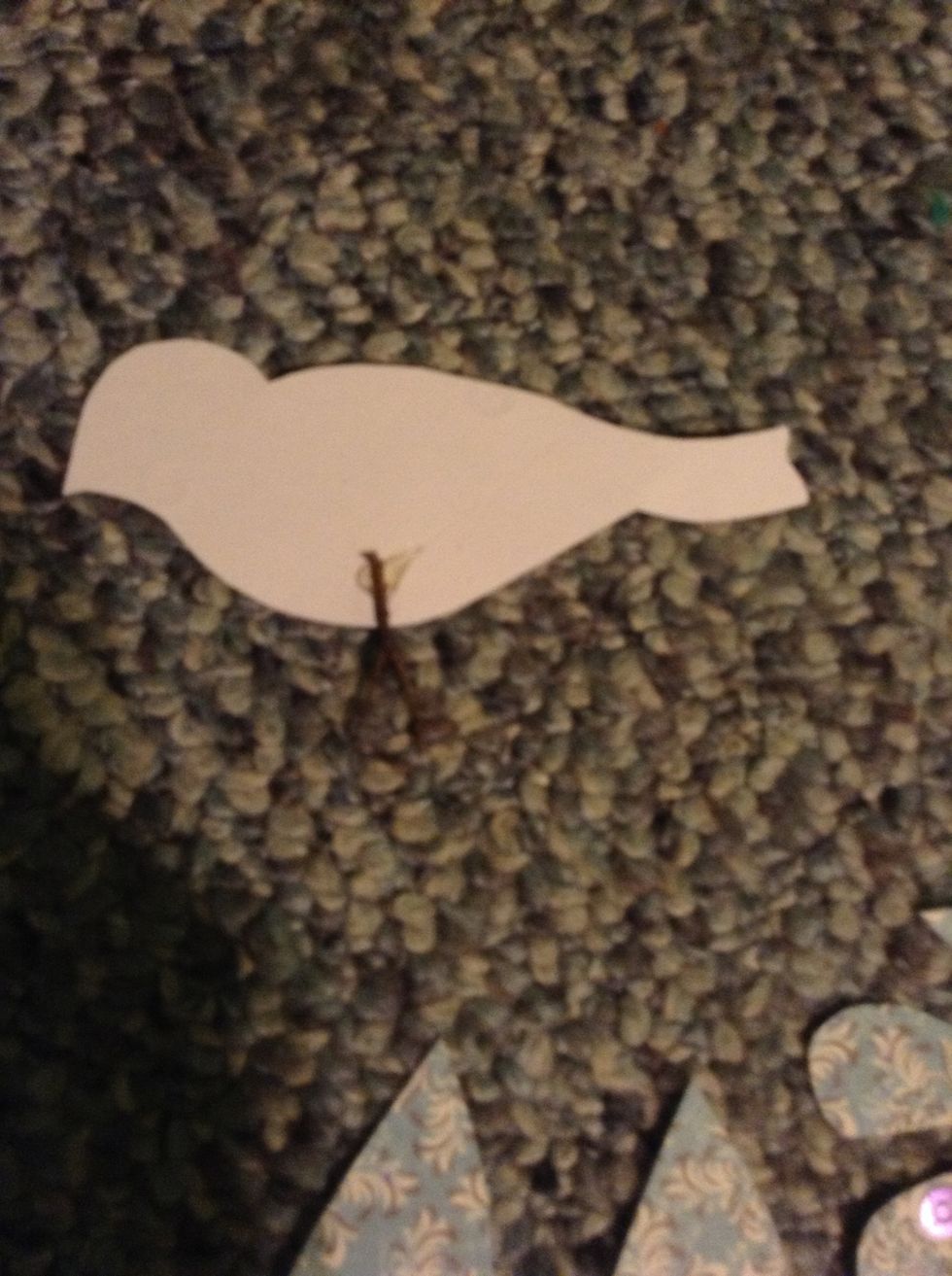 Flip one bird over and hot glue the twig to the back.