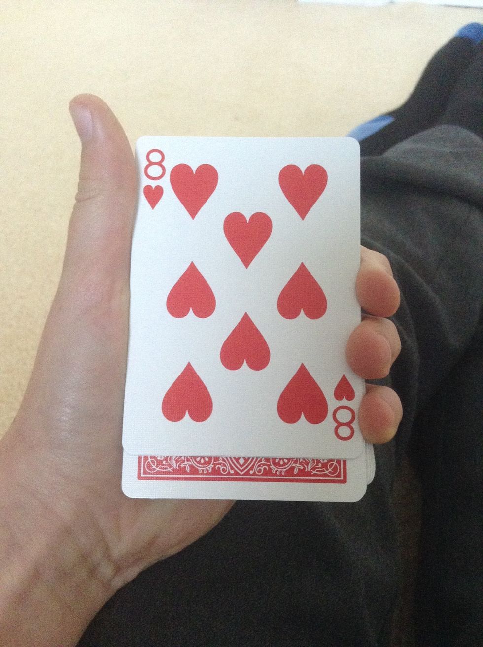 Flip over the 2 cards and say 'Right, we have the 8 of Hearts' (my example) .