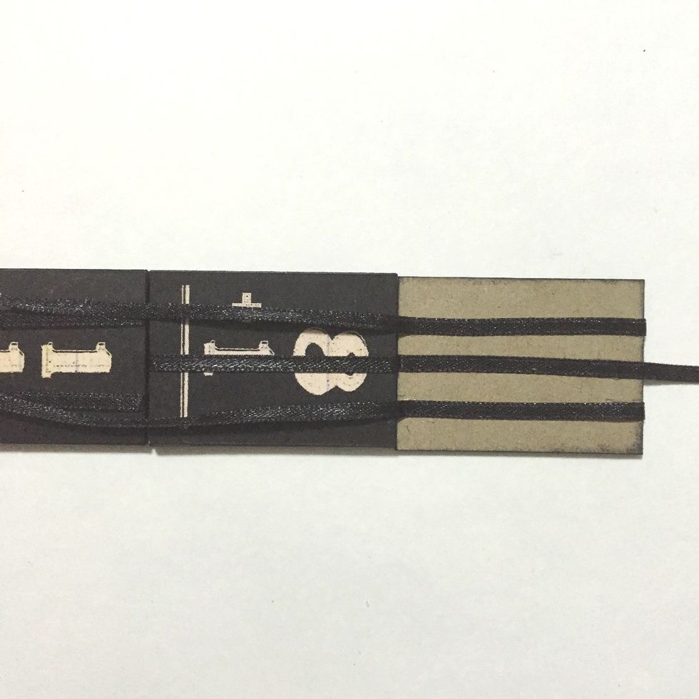 Flip over the 2 ribbons and glue down...