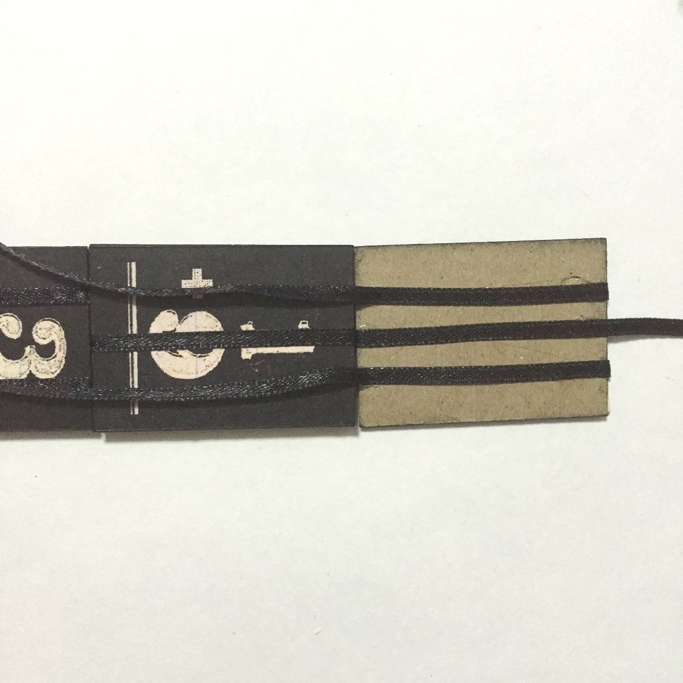 Flip over the 2 ribbons and glue down...