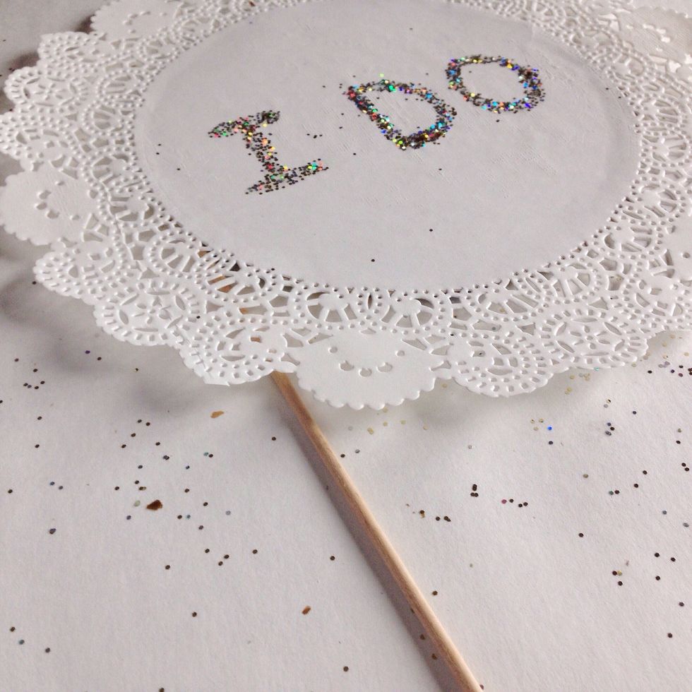 Flip over the doily to make sure the skewer is taped on straight.