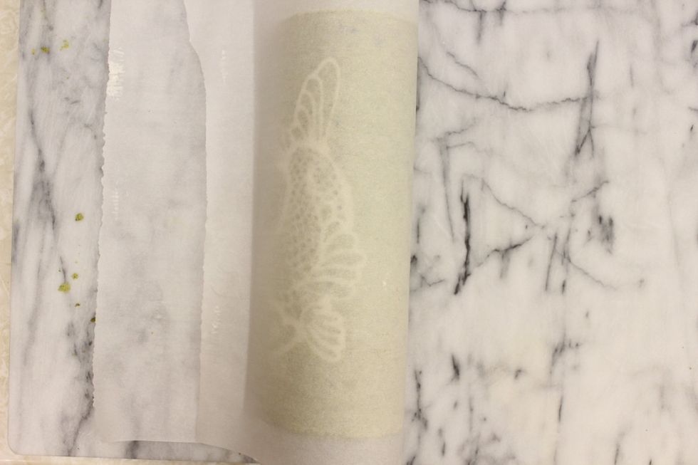 Flip over the right side of the parchment paper.