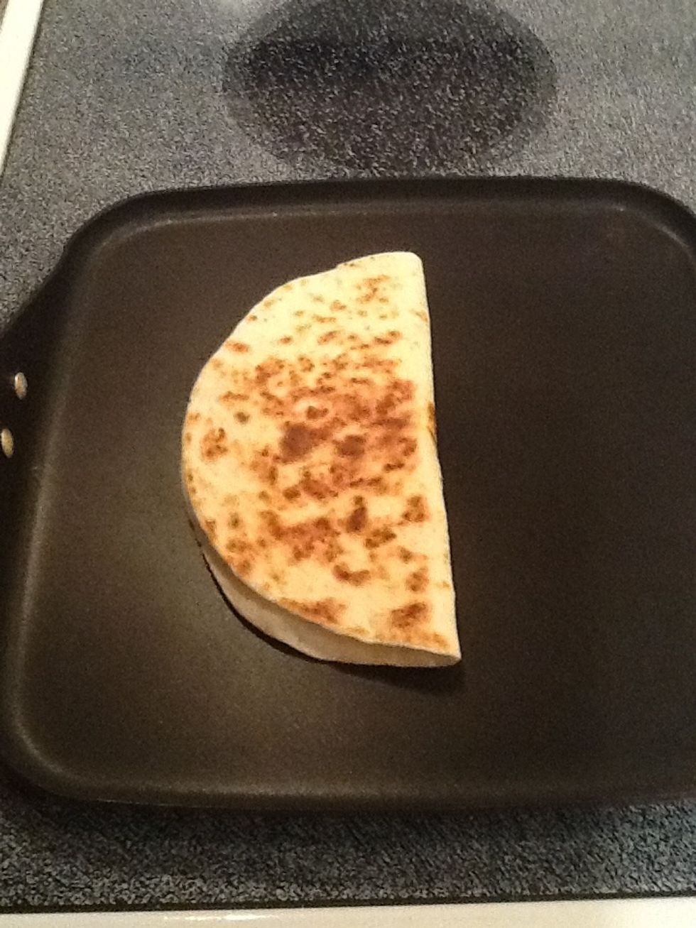 Flip quesadilla. Don't wait too long or it will burn!