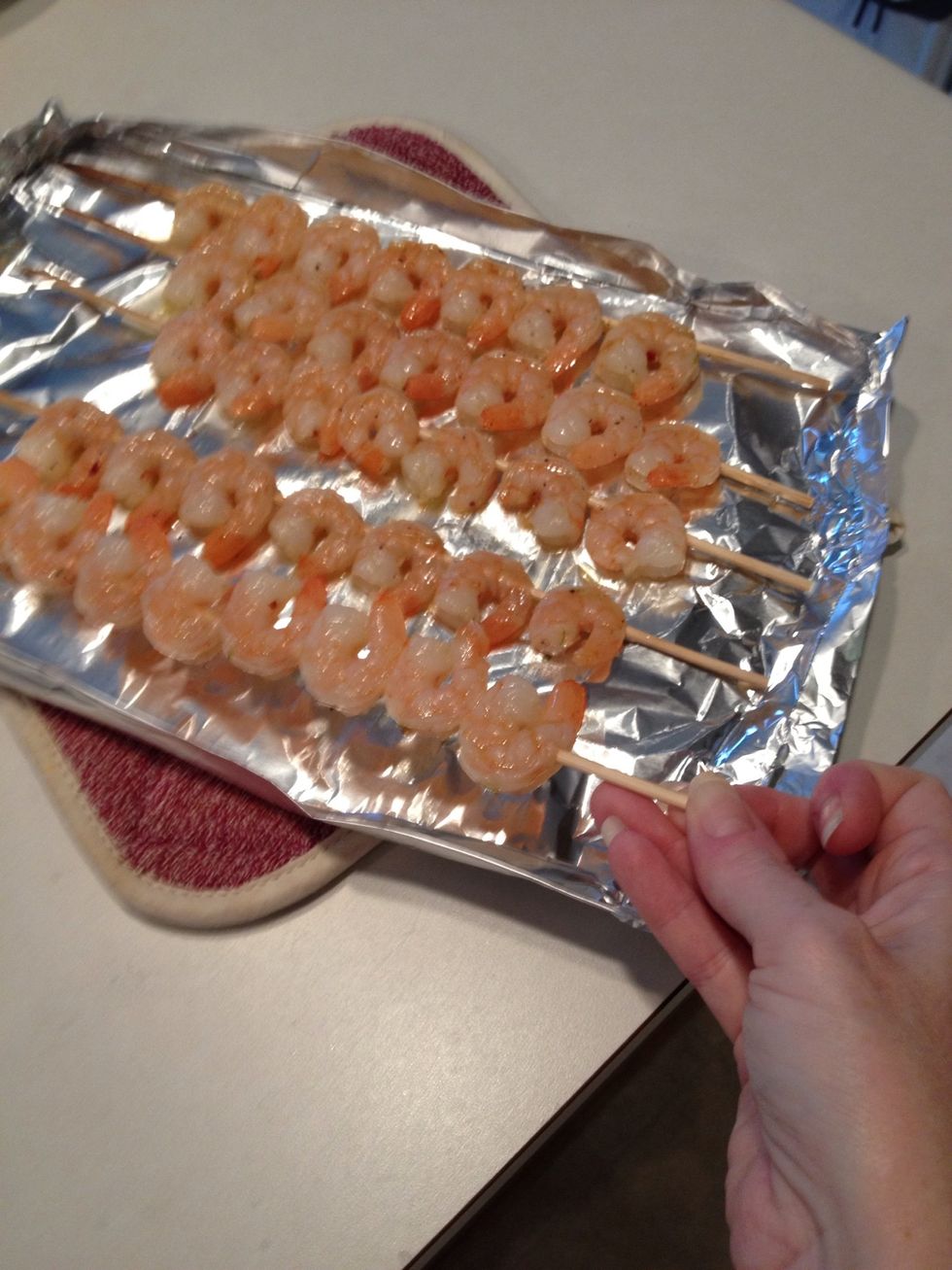 Flip skewers when one side is done.