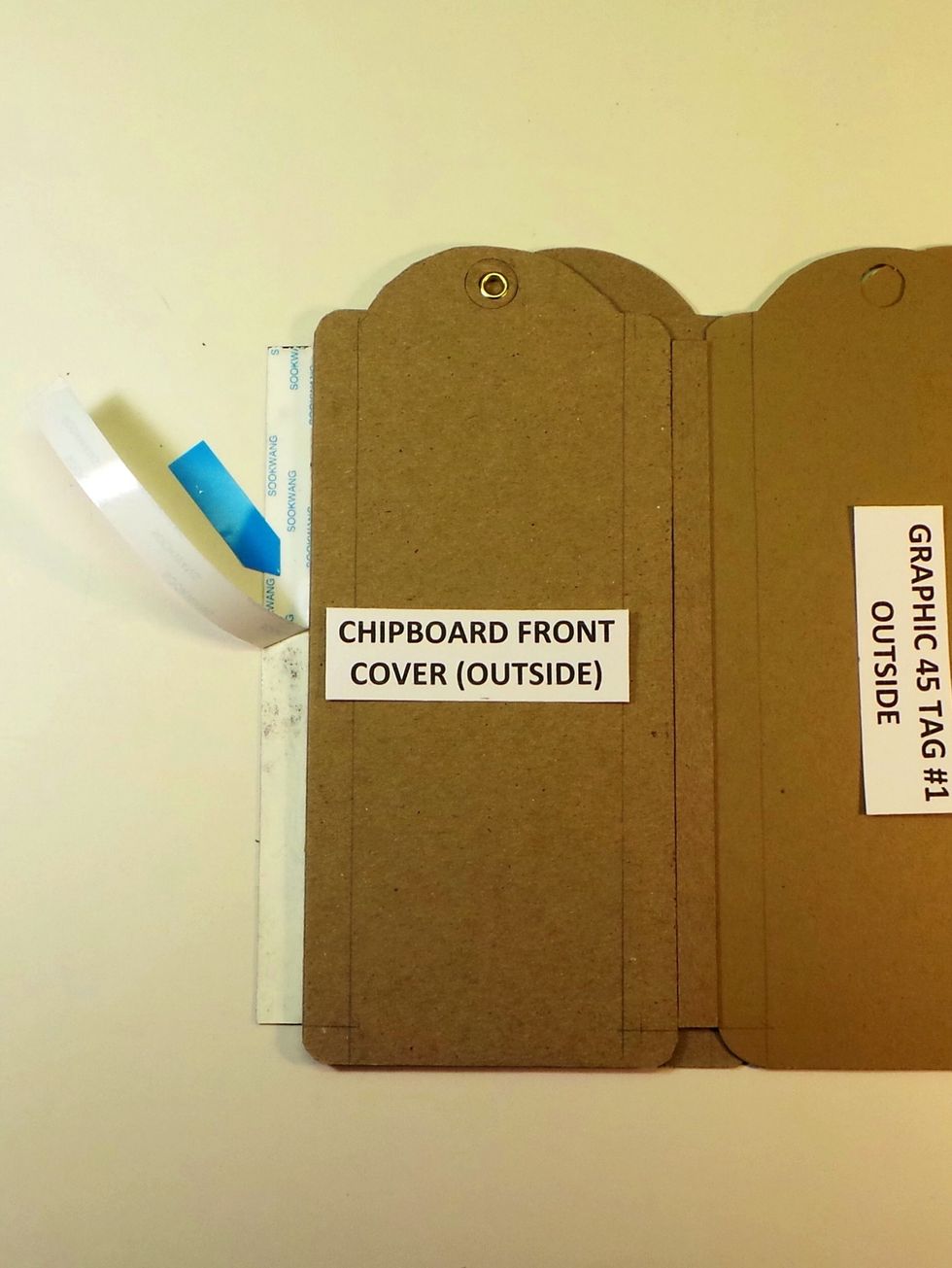 Flip the back cover underneath the Front cover and remove the Scor-Tape backing from the exposed 1/2" of the Tyvek strip