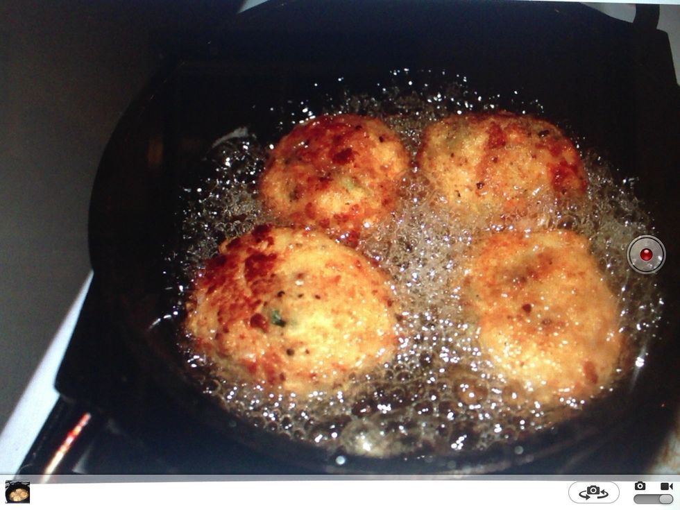 Flip the balls when golden brown