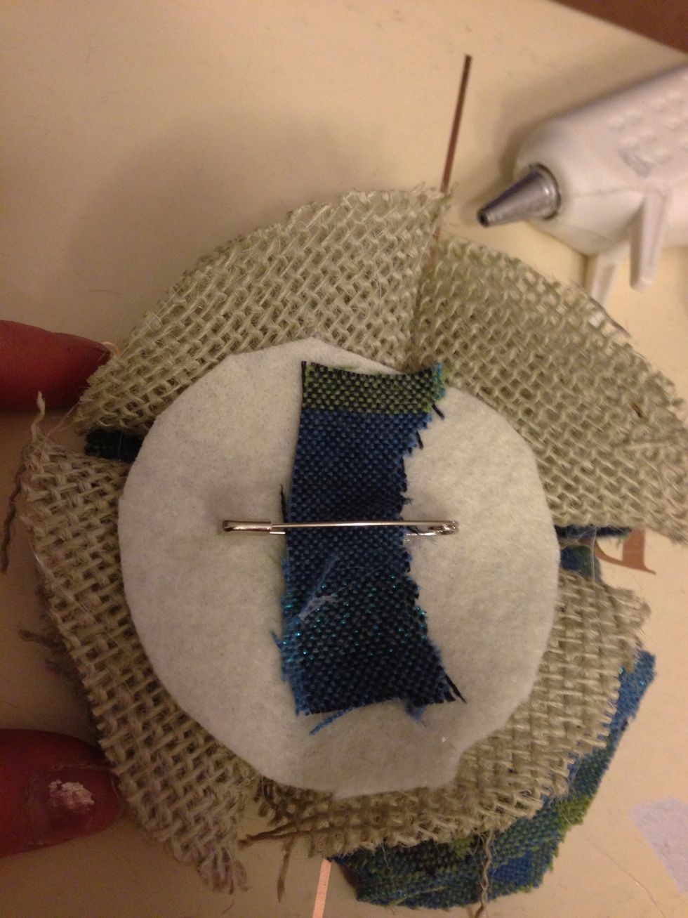 Flip the bow over and secure a safety pin, bobby pin or hair bow clip to the back using a scrap piece of fabric or felt.