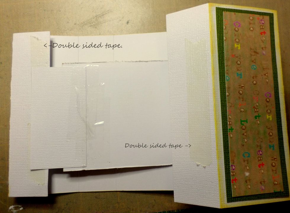 Flip the cardstock with the tag inserted over.  Add double sided tape to the inner and outter edges of the last sections of cardstock on both ends.