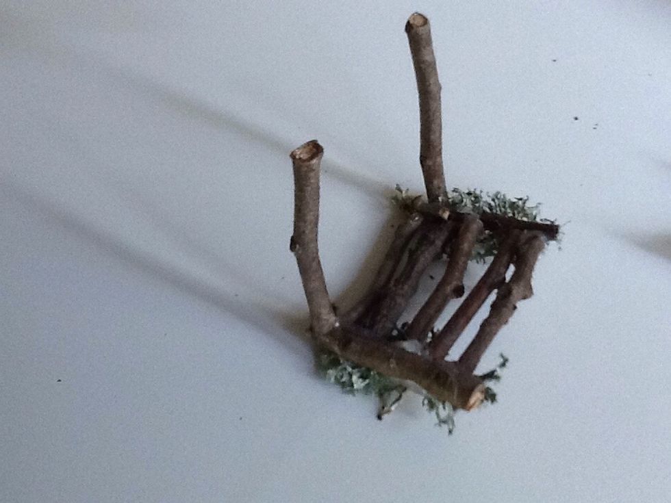 Flip the chair seat over and glue on your 1.5 inch long front legs.