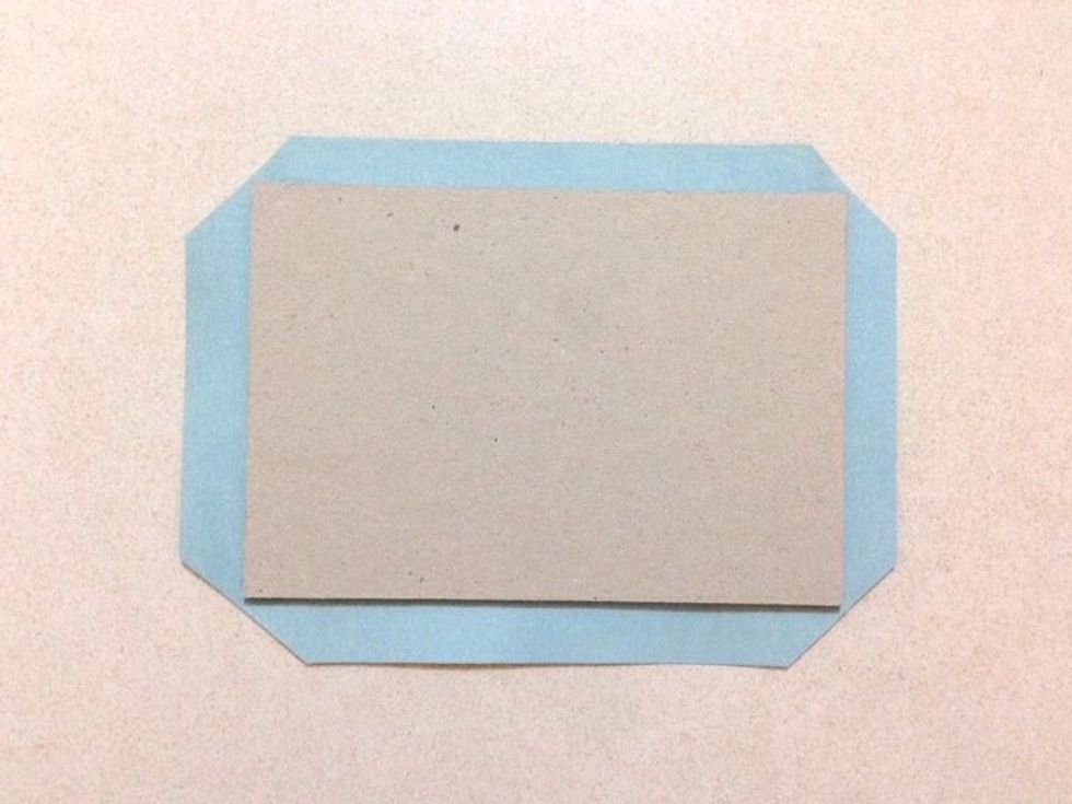 Flip the chipboard over and trim off the corners as shown...