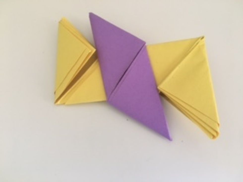 Flip the figure over. Now, the purple piece (which was the Z piece before) has two pockets.