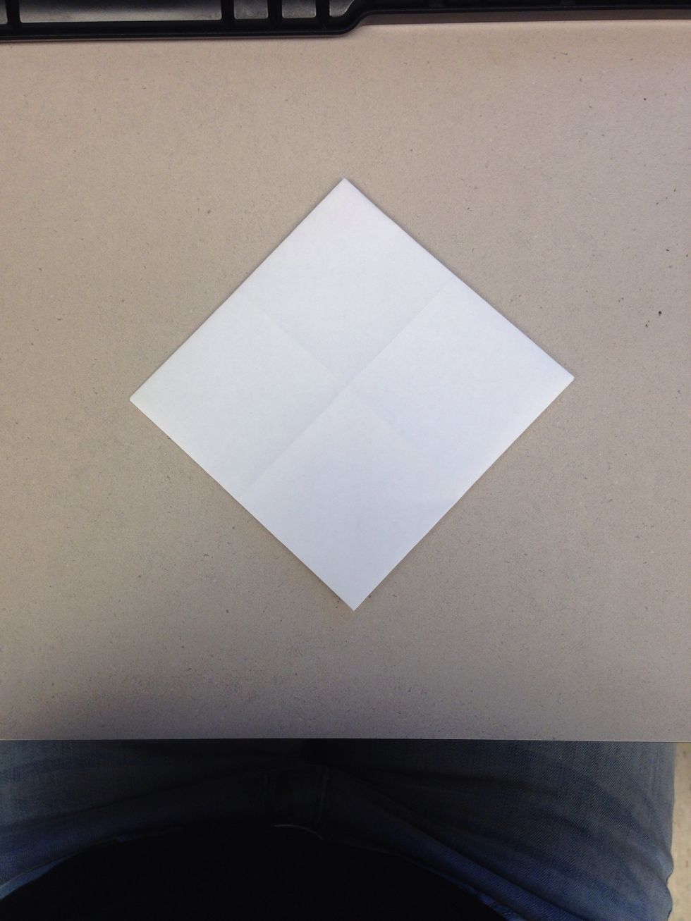 Flip the folded corner paper over.