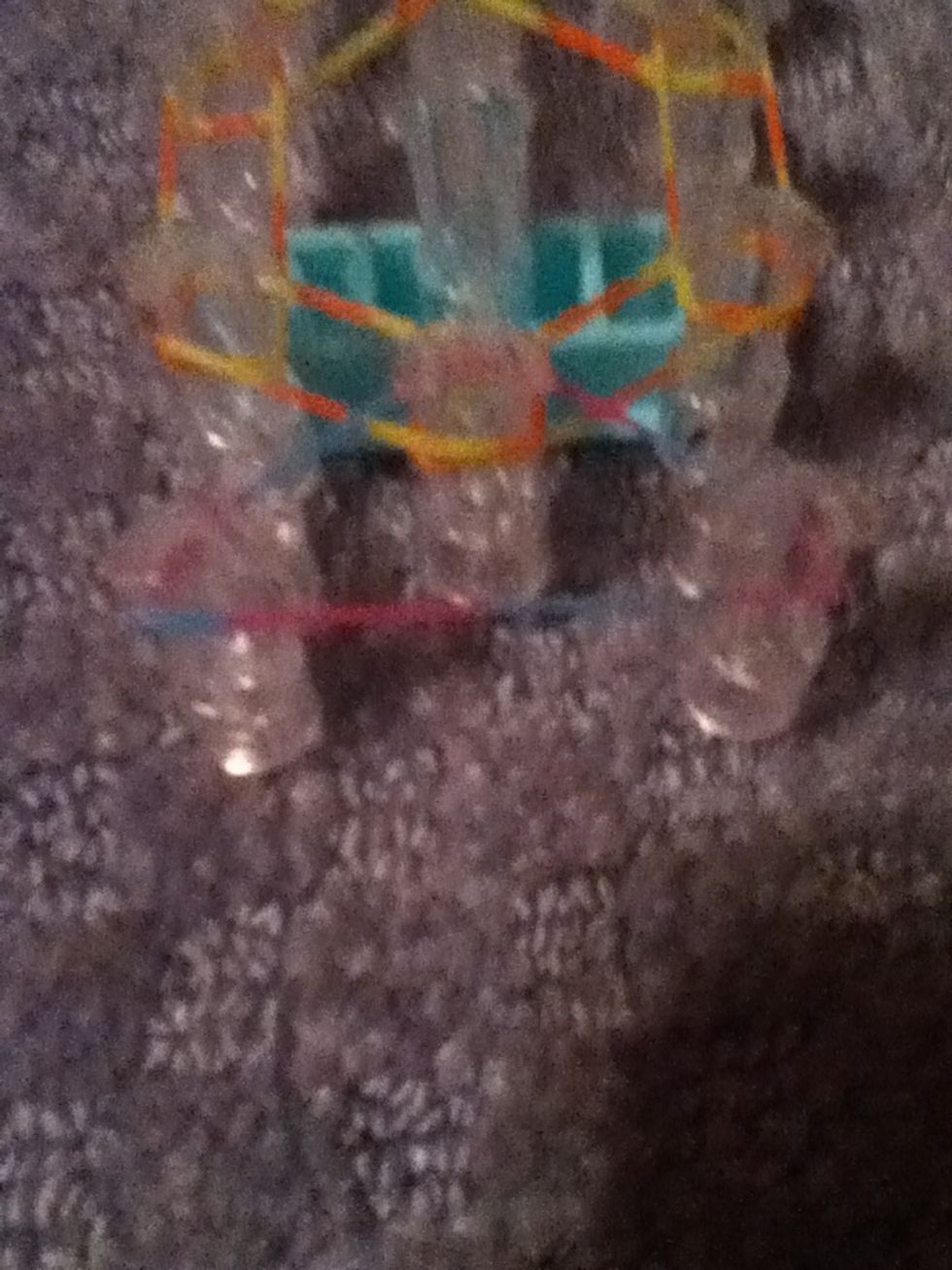 Flip the loom around and put a band on the tree pegs to form a triangle