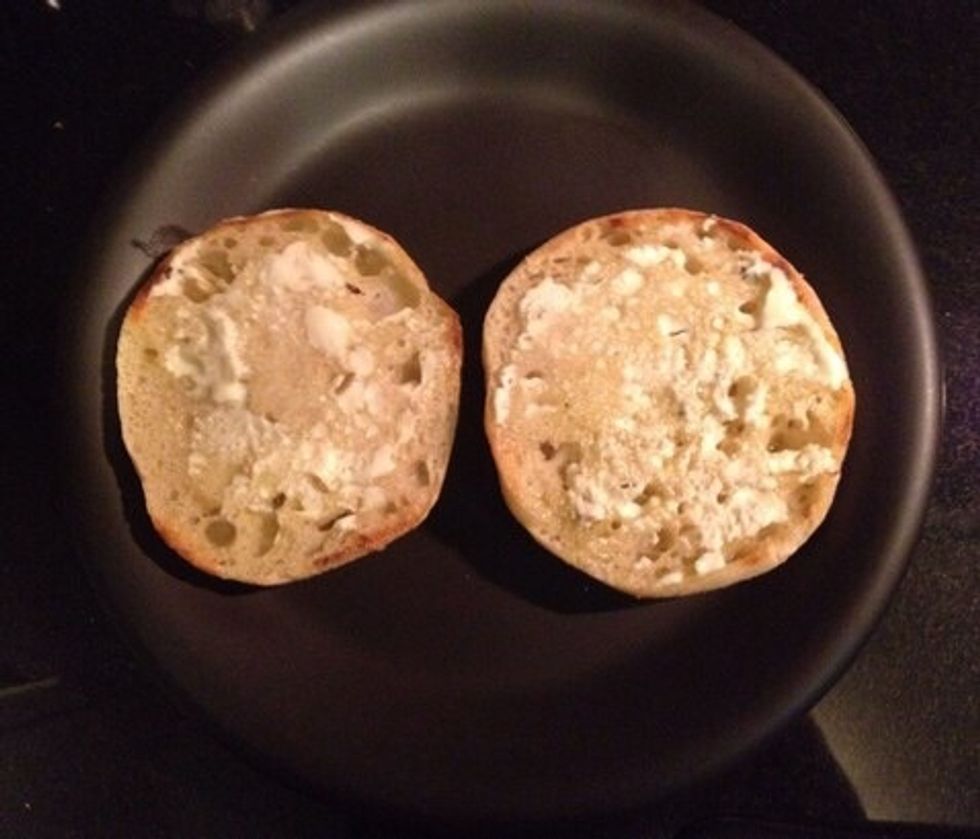 Flip the muffin halves and spread goat cheese on the already toasted side so it gets nice and melty.