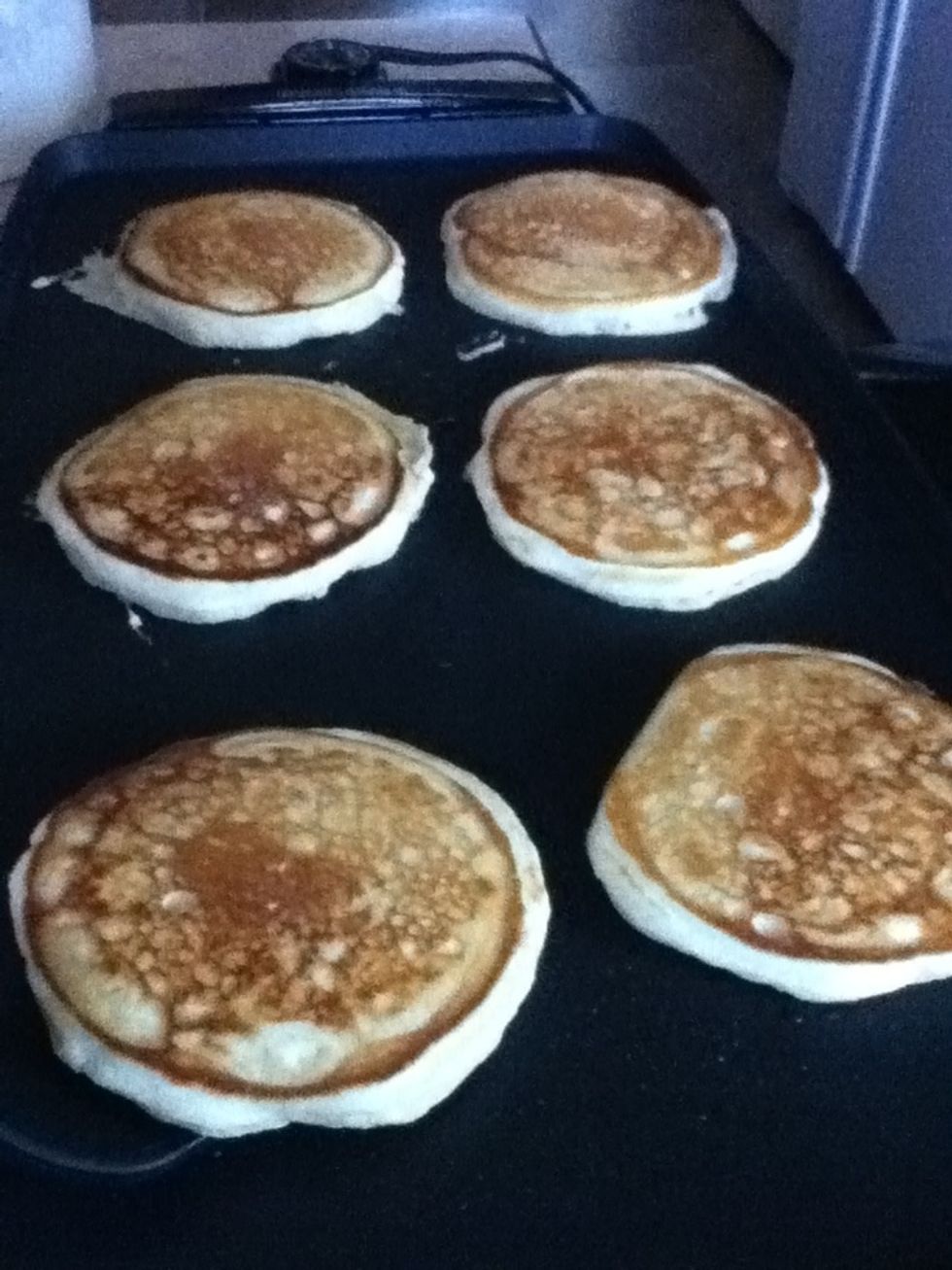 Flip the pancakes over.