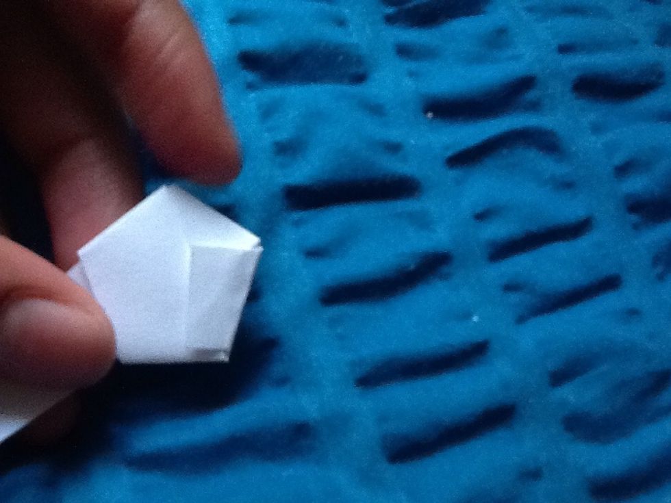 Flip the paper and fold the end of the paper down