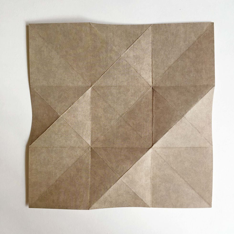 Flip the paper over showing the other side of the pattern paper...