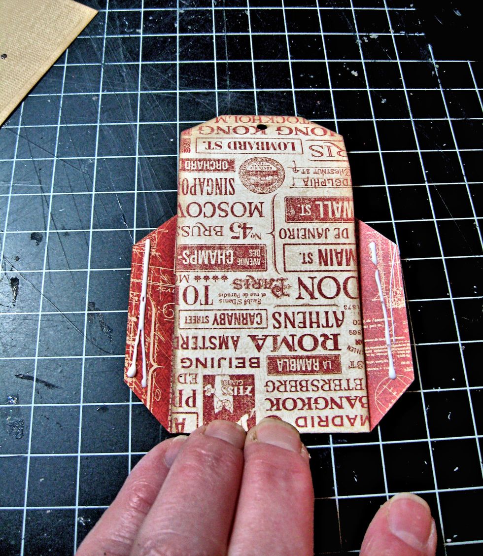 Flip the pocket over and add glue to the flaps.