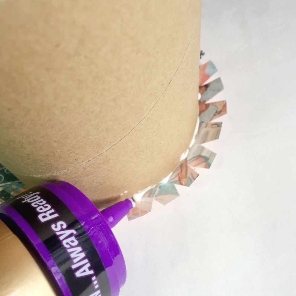 Flip the roll and apply some tacky glue at the edge of the roll.