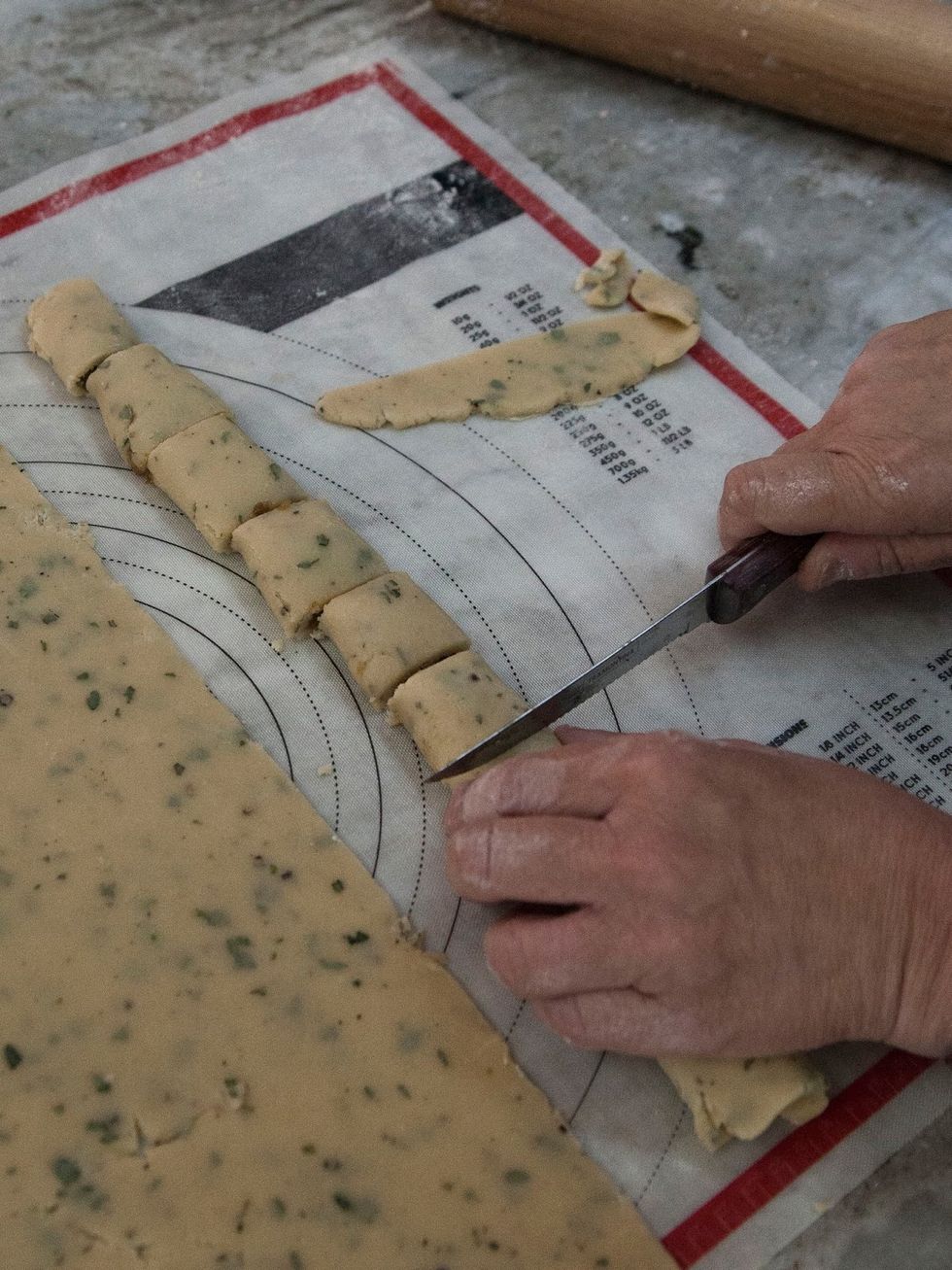 Flip the roll to the unfolded side, and cut them into bite sized Pig Newtons.