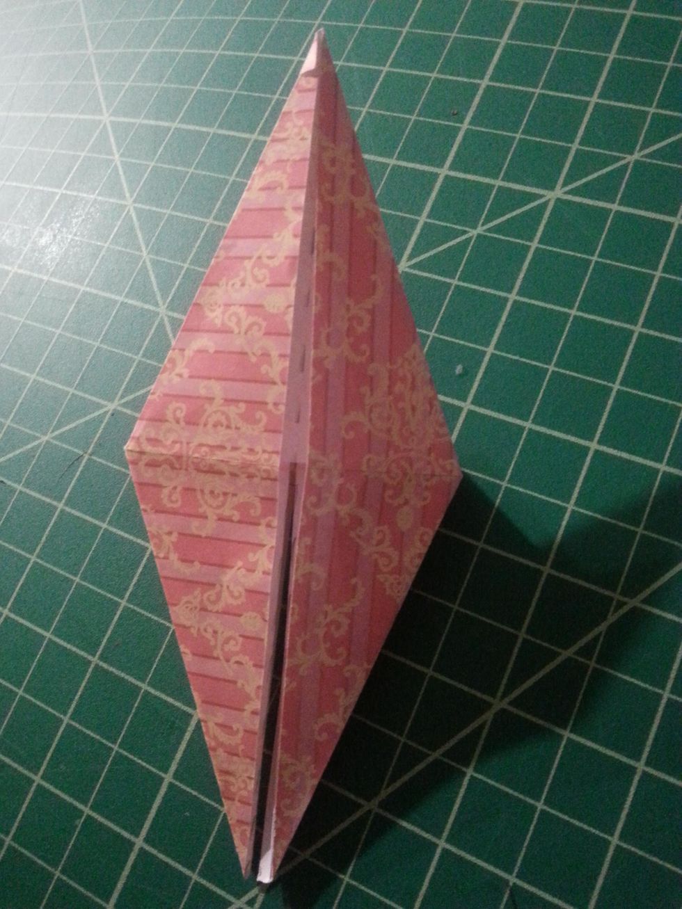 Flip the shape over & repeat steps #11-14, your shape should resemble the shape on the left. REMEMBER, the bottom two flaps should be able to be moved separately, if not, flip the shape upside down.
