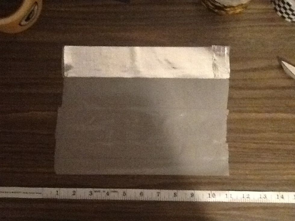 Flip the sheet over to completely cover the other side (sticky side) with duct tape back to back.