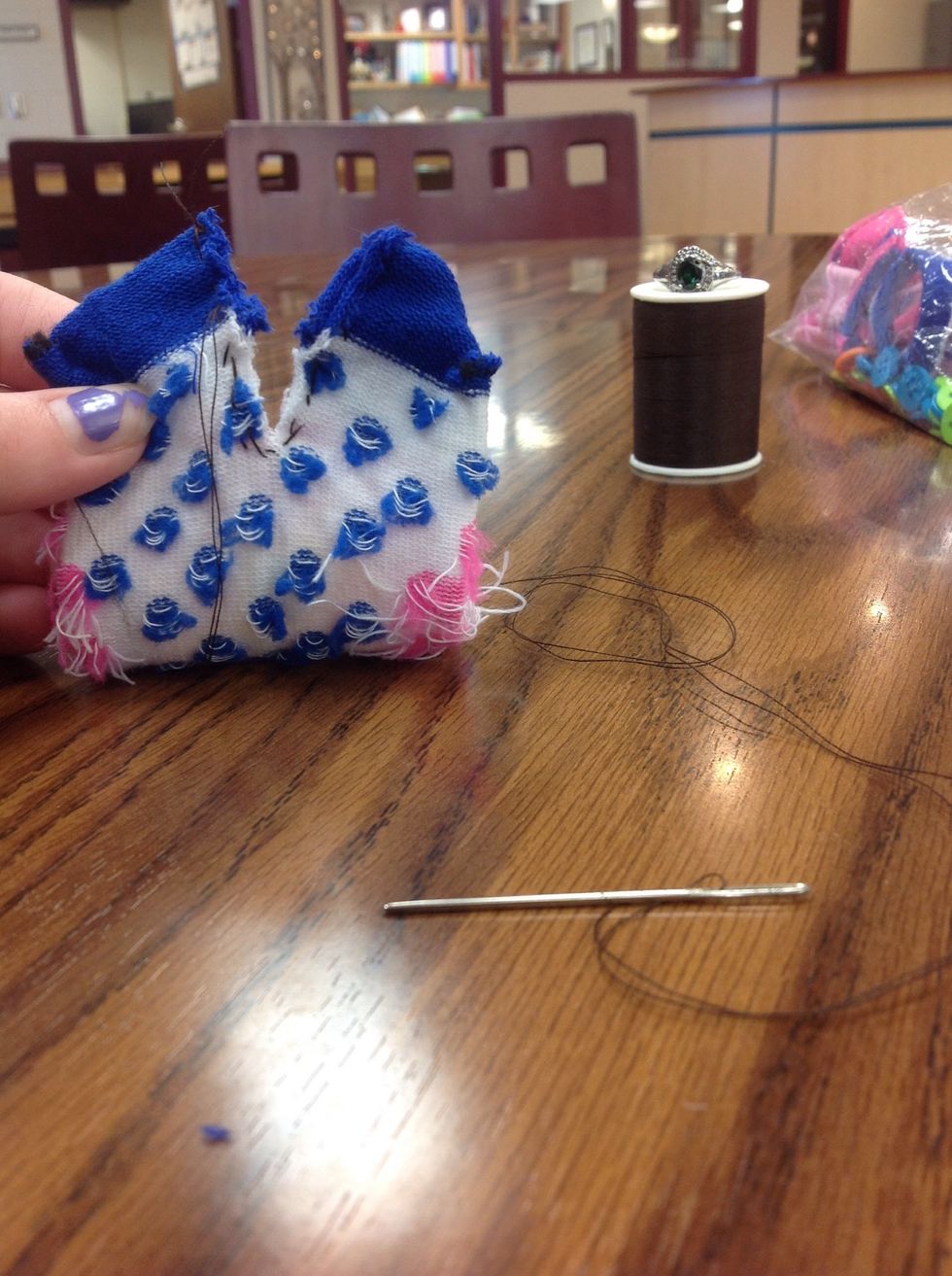 Flip the sock inside out and sew the cut toe area into "bunny ears"