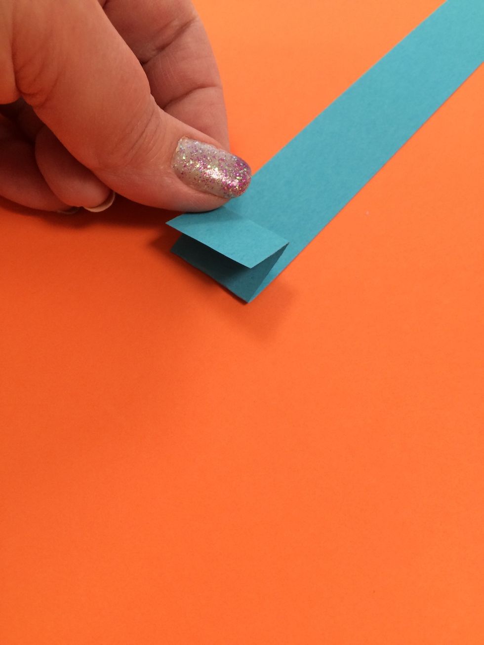 Flip the strip over after each fold.