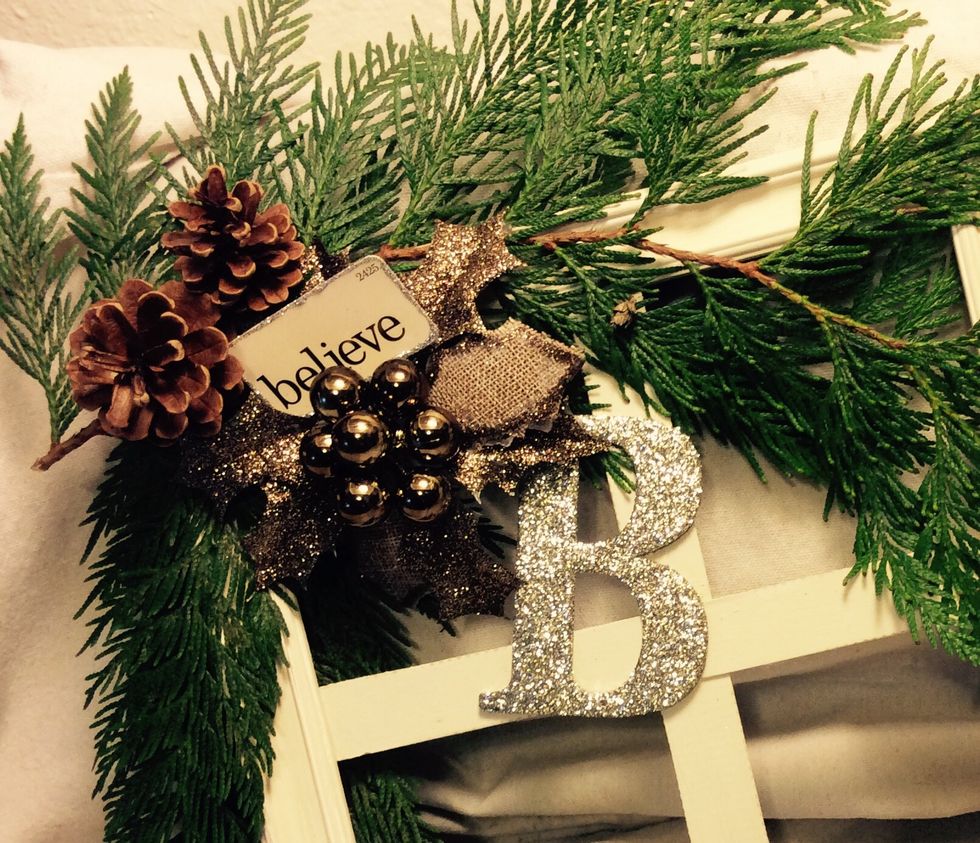 Flip window over, add a sprig or two more of the cedar clippings then embellish as desired. Use decorative picks, monograms, pine cones, holly, bows, etc.