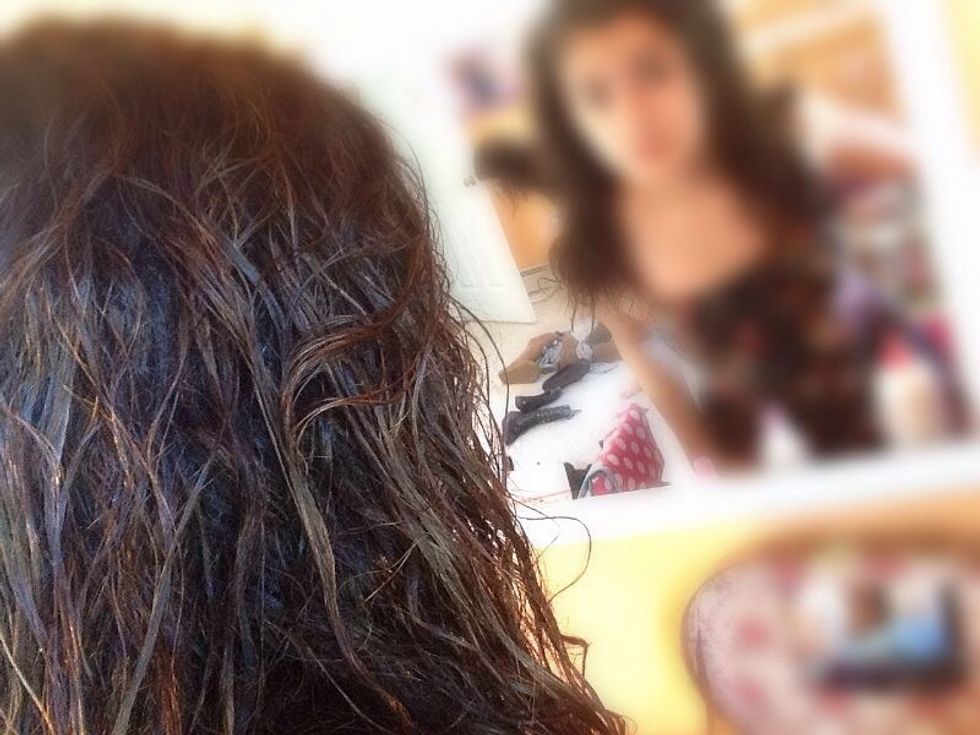 Flip you head upside down and gentle run your fingers through it to get those curls back:) now flip your head back up and part your hair.