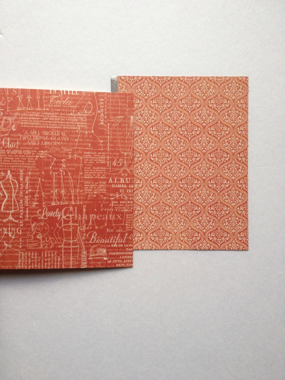 Flip your 4.5" wide paper to reveal the pattern side again. Grab your 5.5" wide paper, pattern side up. Place 5.5" wide paper over the 4.5" paper so there is about a 1/2" overlap.