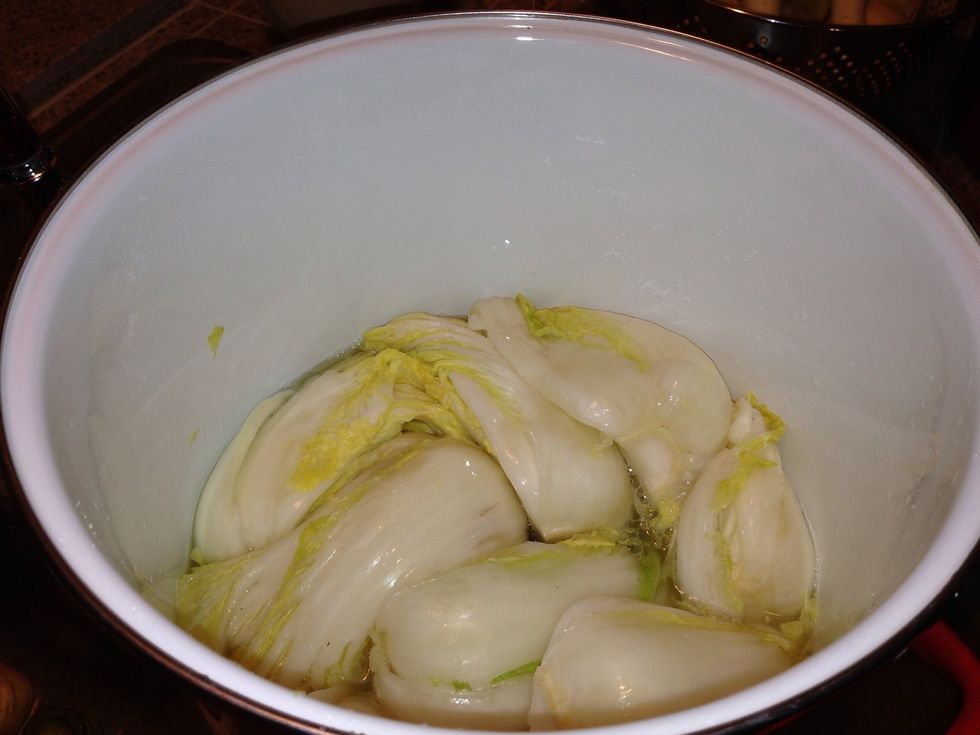Flip your cabbage halves on their sides after 1 1/2 hours, and make sure they're totally immersed in the juices. Cover and let cure for an additional 1 1/2 hours.