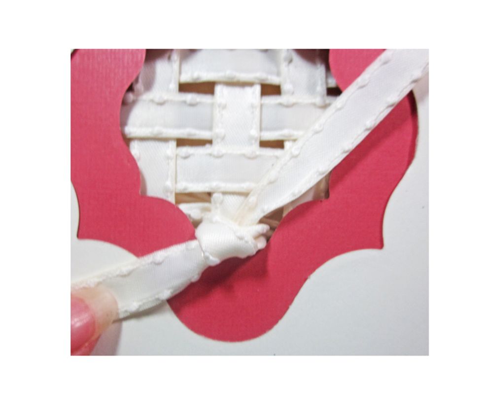 Flip your card open and then tie a knot to secure the bow.