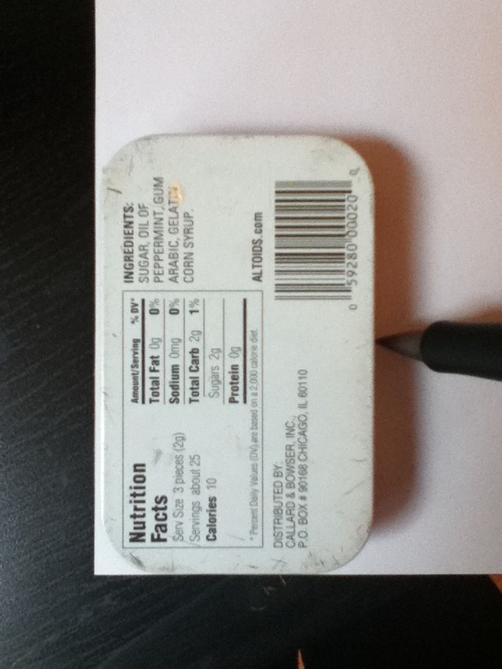 Flip your paper and your tim over, and trace around the tin. Be careful!
