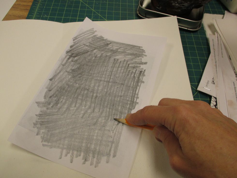 Flip your printed image over and cover it with graphite using a pencil. This way you don't need transfer paper.