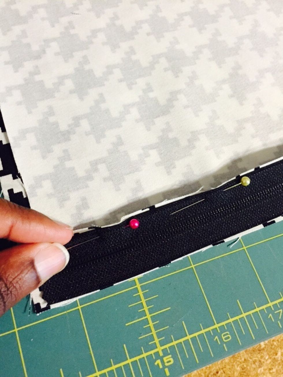 Flip zipper up to match unpinned edge to right side up fabric.