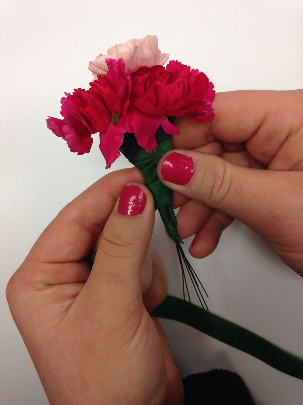 Floral tape the different flowers together.